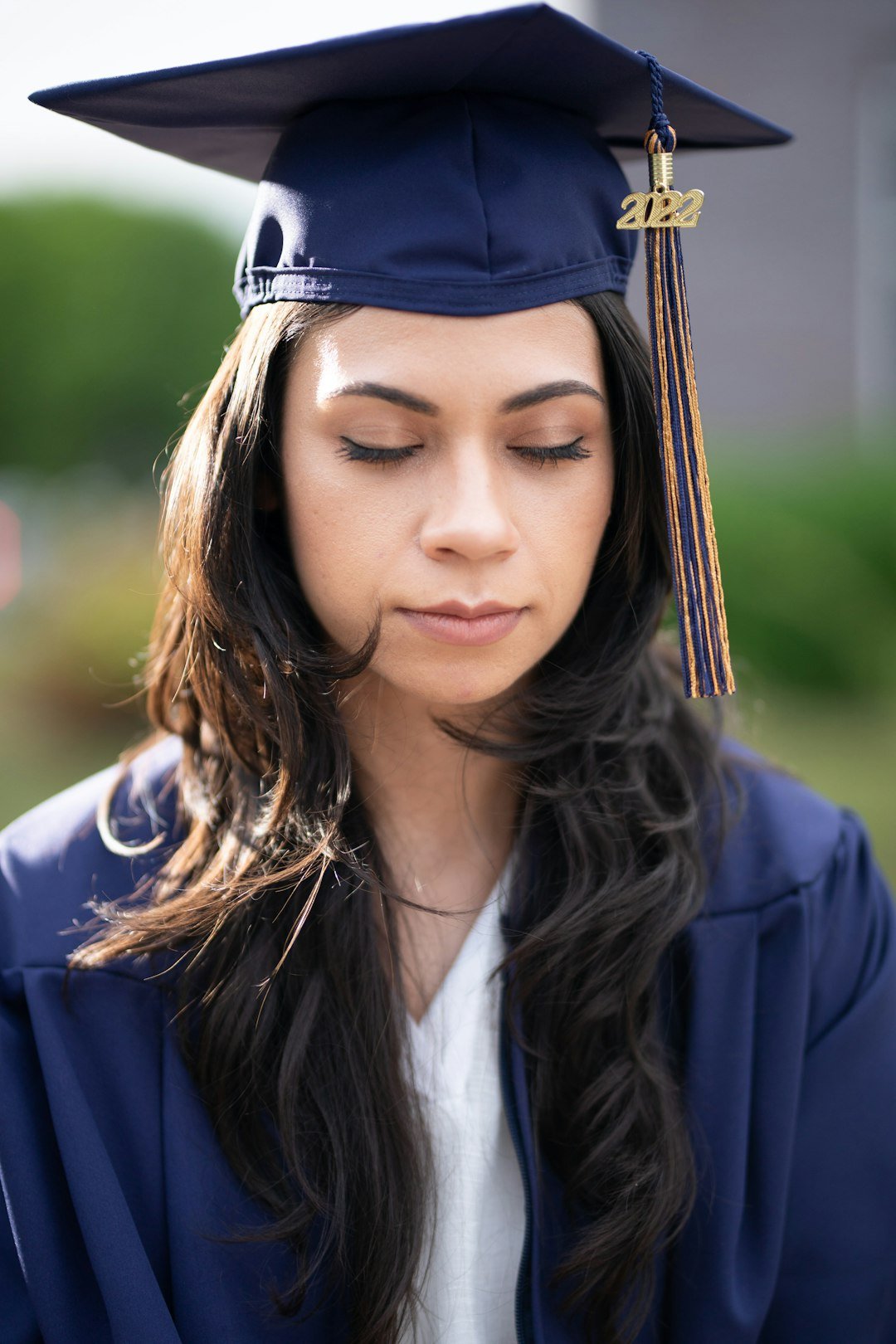 portfolio-02 a-woman-wearing-a-graduation-cap-and-gown-tdqm6yxj4bi